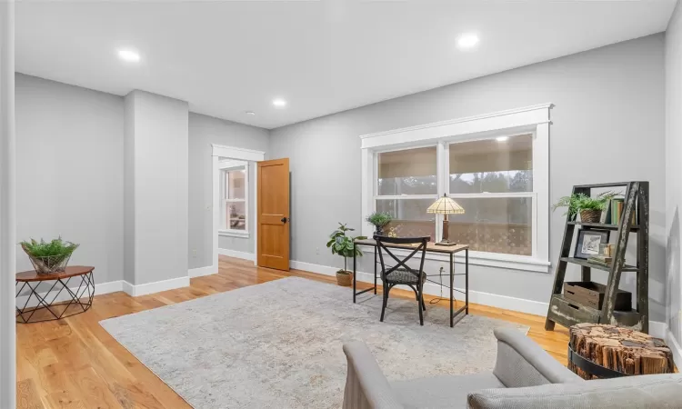 Office space with hardwood / wood-style floors