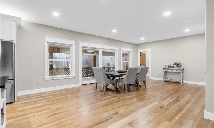 Dining space with light wood-type flooring