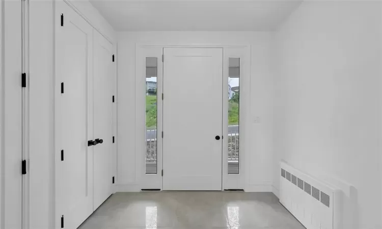 Foyer featuring light tile flooring