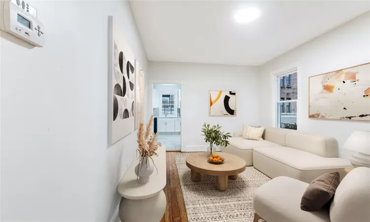 Virtually Staged Living room with hardwood / wood-style flooring