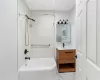 Bathroom with vanity and tiled shower / bath