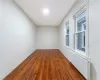 Second Angle of Unfurnished Bedroom #1 featuring dark hardwood / wood-style flooring and radiator heating unit