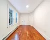 Bedroom. #2 with baseboard heating and dark hardwood / wood-style floors