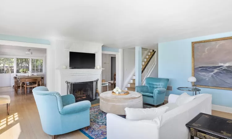 Living room featuring a fireplace and light hardwood / wood-style floors