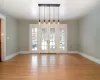 living room featuring a tile fireplace and light hardwood floors