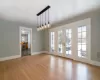 living room with wood flooring, French doors, and a fireplace