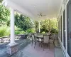 View of patio with ceiling fan, an outdoor fire pit, and grilling area