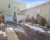 View of snow covered back of property