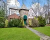 Tudor house with a front yard