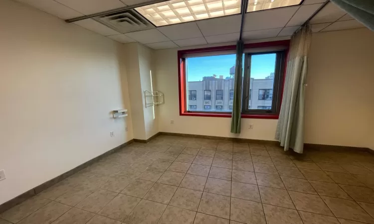 Unfurnished room featuring a paneled ceiling