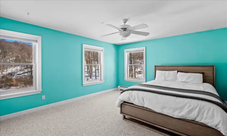 Bedroom featuring carpet and ceiling fan