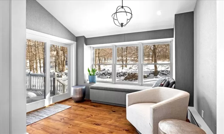 Entryway with hardwood / wood-style flooring