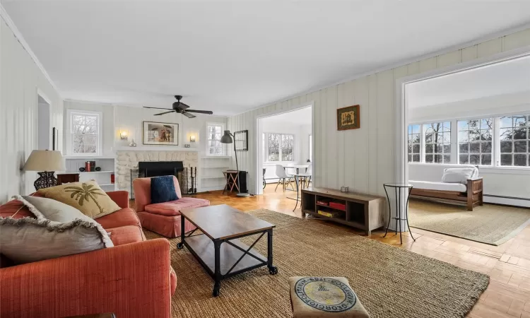 Living room with plenty of natural light and light parquet flooring