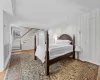 Bedroom featuring crown molding and wood-type flooring