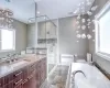 Full bathroom with radiator heating unit, toilet, vanity, and separate shower and tub