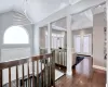 Foyer entrance featuring high vaulted ceiling, an inviting chandelier, dark hardwood / wood-style flooring, and french doors