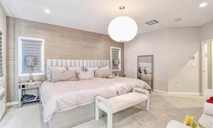 Bedroom with radiator heating unit