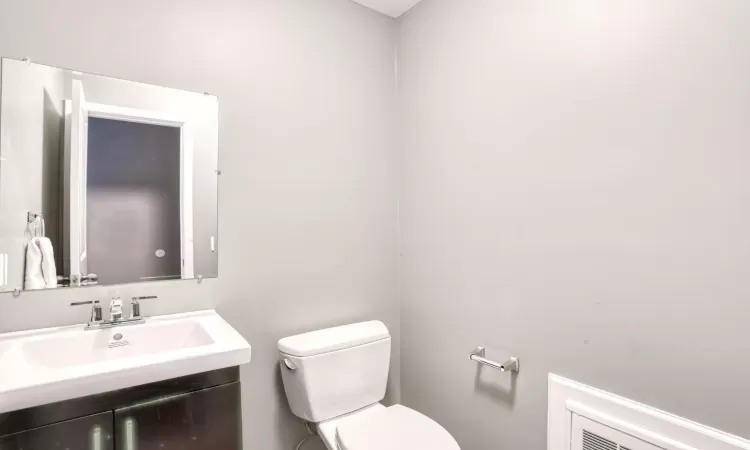 Bathroom featuring toilet and vanity