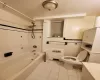 Full bathroom featuring tile walls