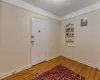 Entrance foyer with hardwood / wood-style floors