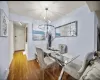 Dining space with a chandelier and hardwood / wood-style floors