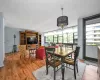 Dining space with wood-type flooring and a notable chandelier