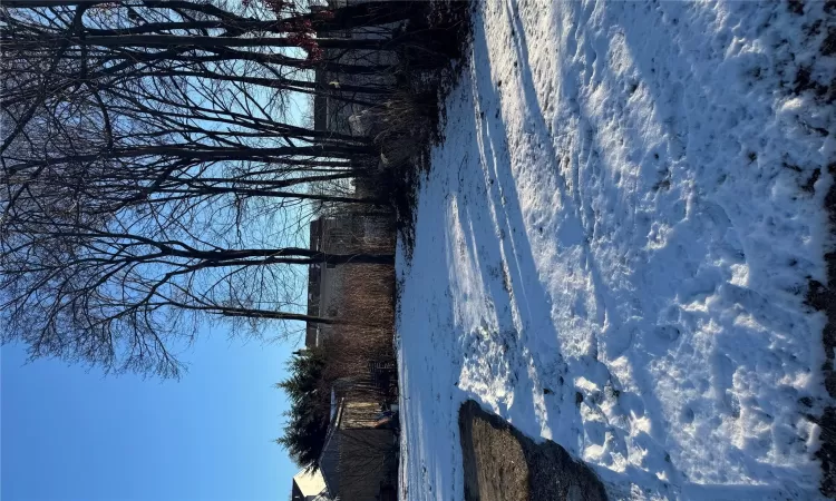 View of yard layered in snow