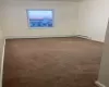 Unfurnished room featuring carpet