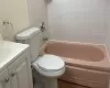 Bathroom with tile patterned flooring, vanity, and toilet