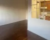 Kitchen with ceiling fan, dark wood-type flooring, and white range with gas cooktop