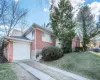 Ranch home featuring a garage and a front yard