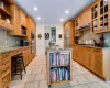 Kitchen with sink, a breakfast bar, backsplash, stainless steel appliances, and a center island with sink