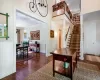 Entryway with dark hardwood / wood-style flooring and ornamental molding