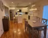 Dining area with sink and wood-type flooring