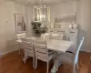 Dining area featuring an inviting chandelier and dark hardwood / wood-style floors