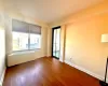 Bedroom #2 featuring hardwood floors and Balcony.