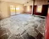 Empty room featuring a textured ceiling