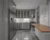 Kitchen with sink, wooden counters, appliances with stainless steel finishes, gray cabinetry, and tasteful backsplash