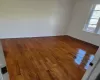 Unfurnished room with hardwood / wood-style flooring