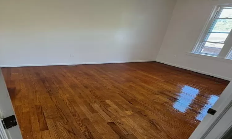 Unfurnished room with hardwood / wood-style flooring