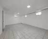 Basement featuring light tile patterned floors