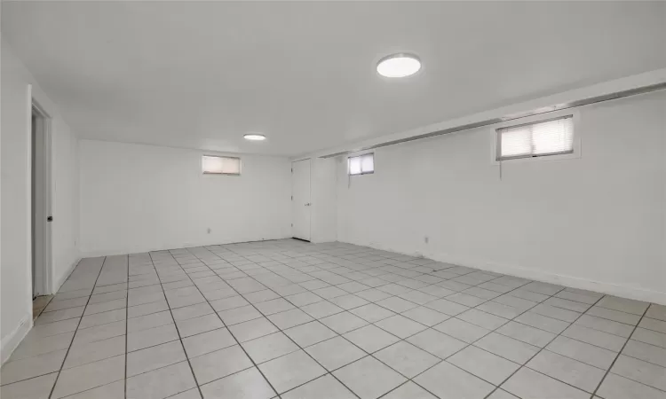 Basement featuring light tile patterned floors