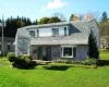 View of front of property with a front yard