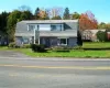 View of front facade featuring a front yard