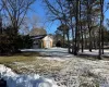 View of yard covered in snow