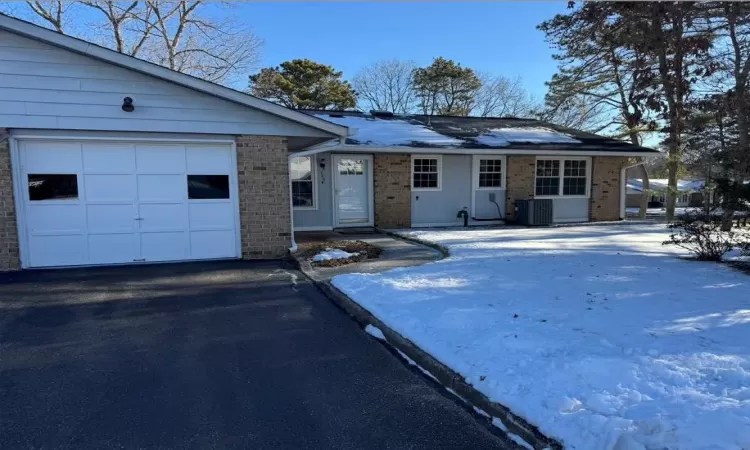 Ranch-style home with central AC unit