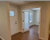 Entryway featuring dark hardwood / wood-style flooring and baseboard heating