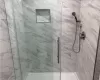 Bathroom featuring a shower with shower door