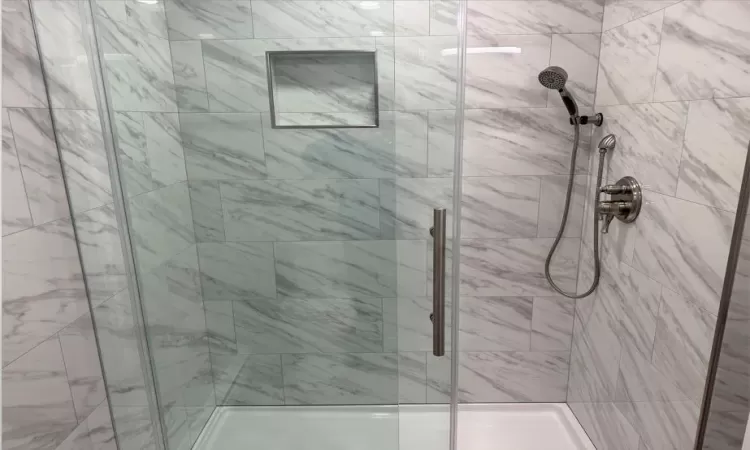 Bathroom featuring a shower with shower door