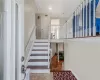 Staircase featuring parquet flooring